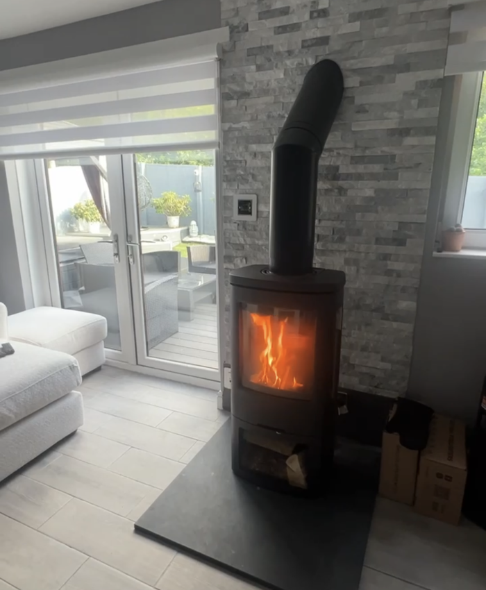 Termatech TT44G wood-burning stove with twin-wall chimney system.